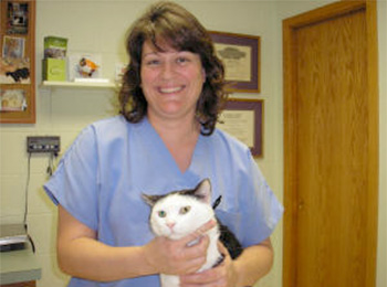 Dr. Kelly Jones Holding Black and White Cat